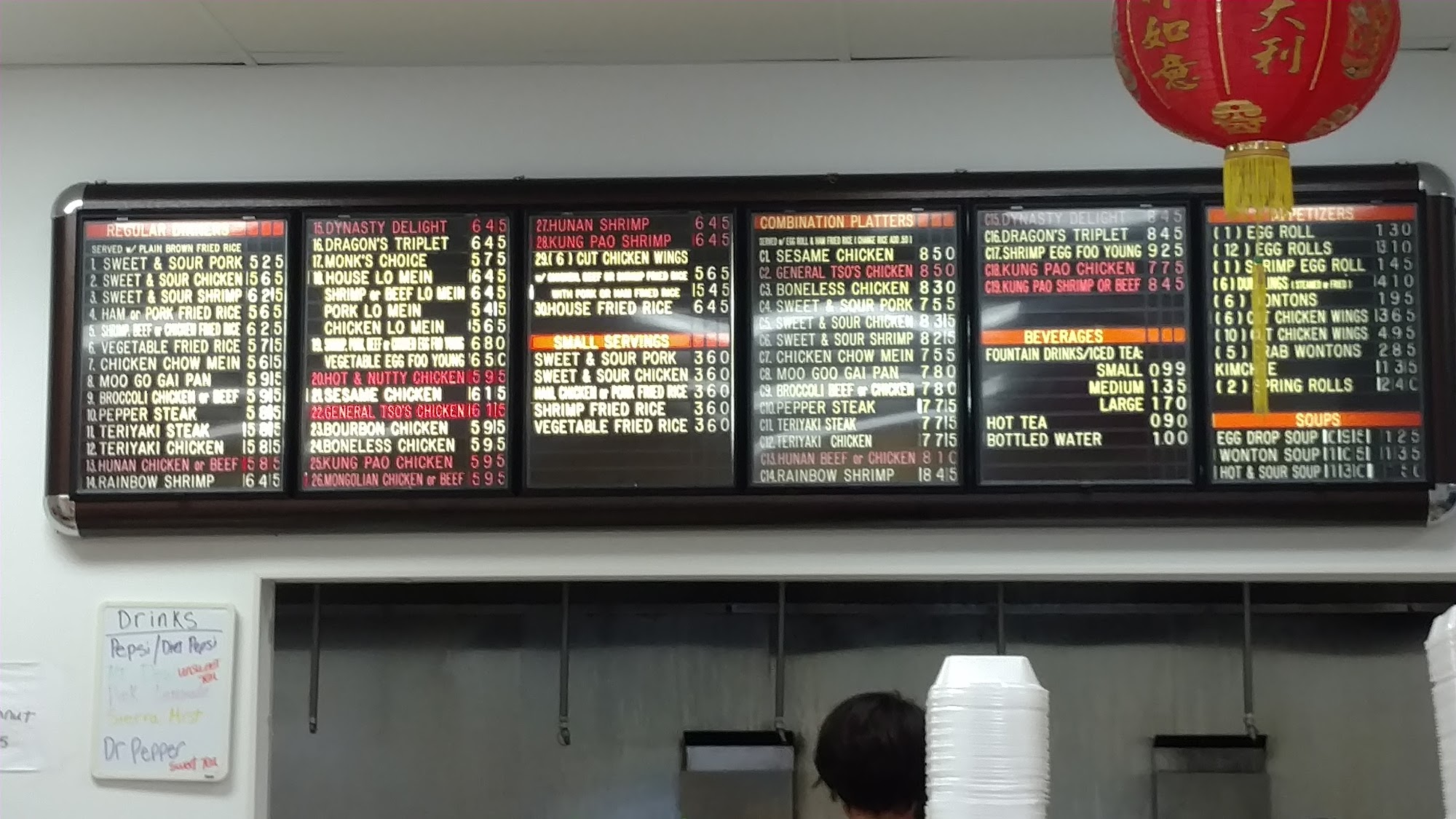 In-store menu board at Egg Roll Express